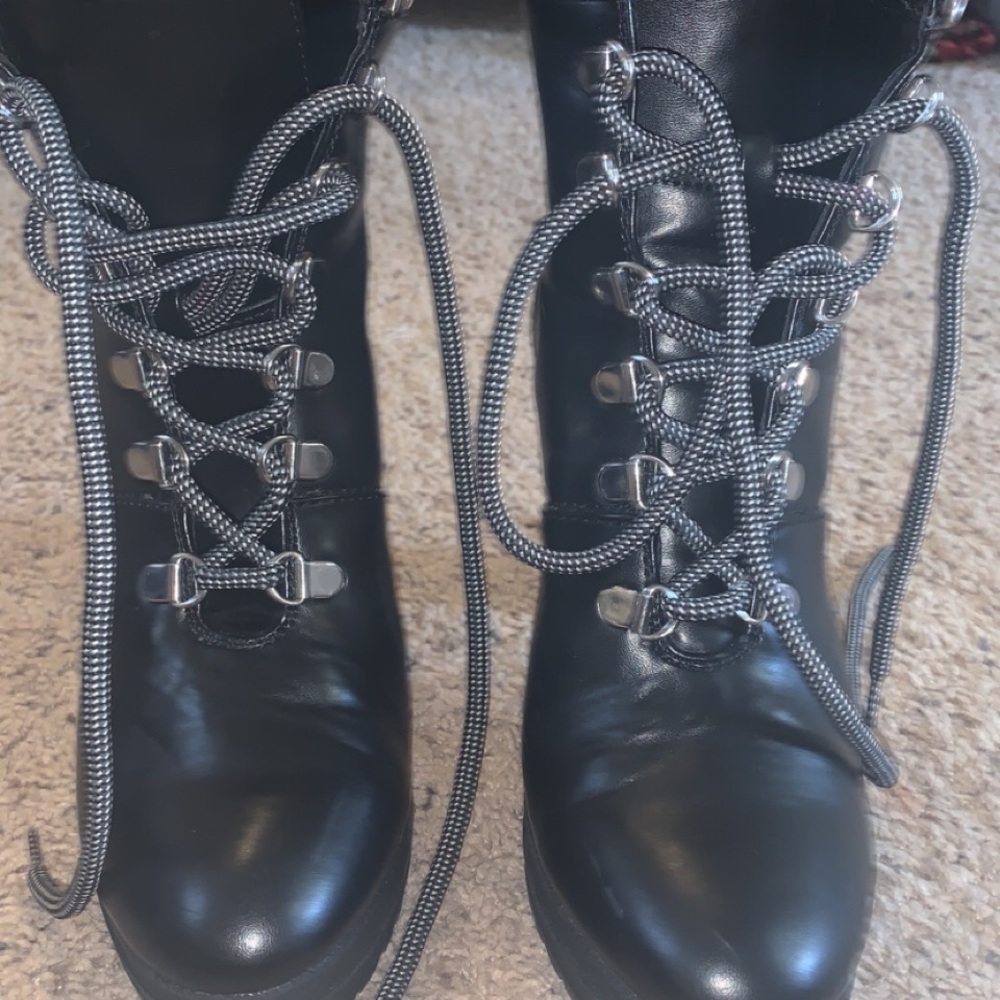DKNY high heeled patent Lee at her boots.